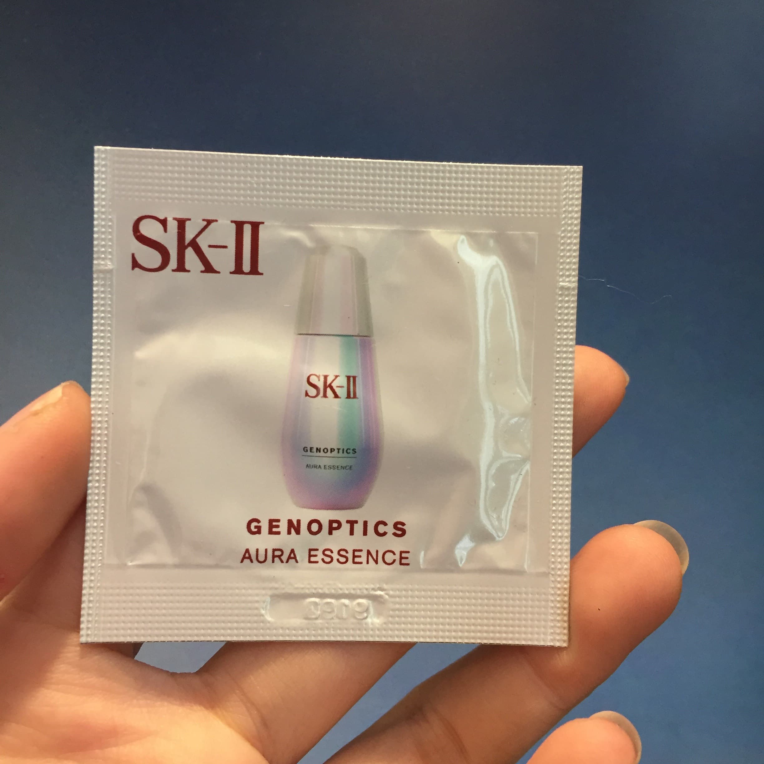 Serum SKII Tinh chất dưỡng trắng da Genoptics Aura Essence gói 0.7ml - Có bill US