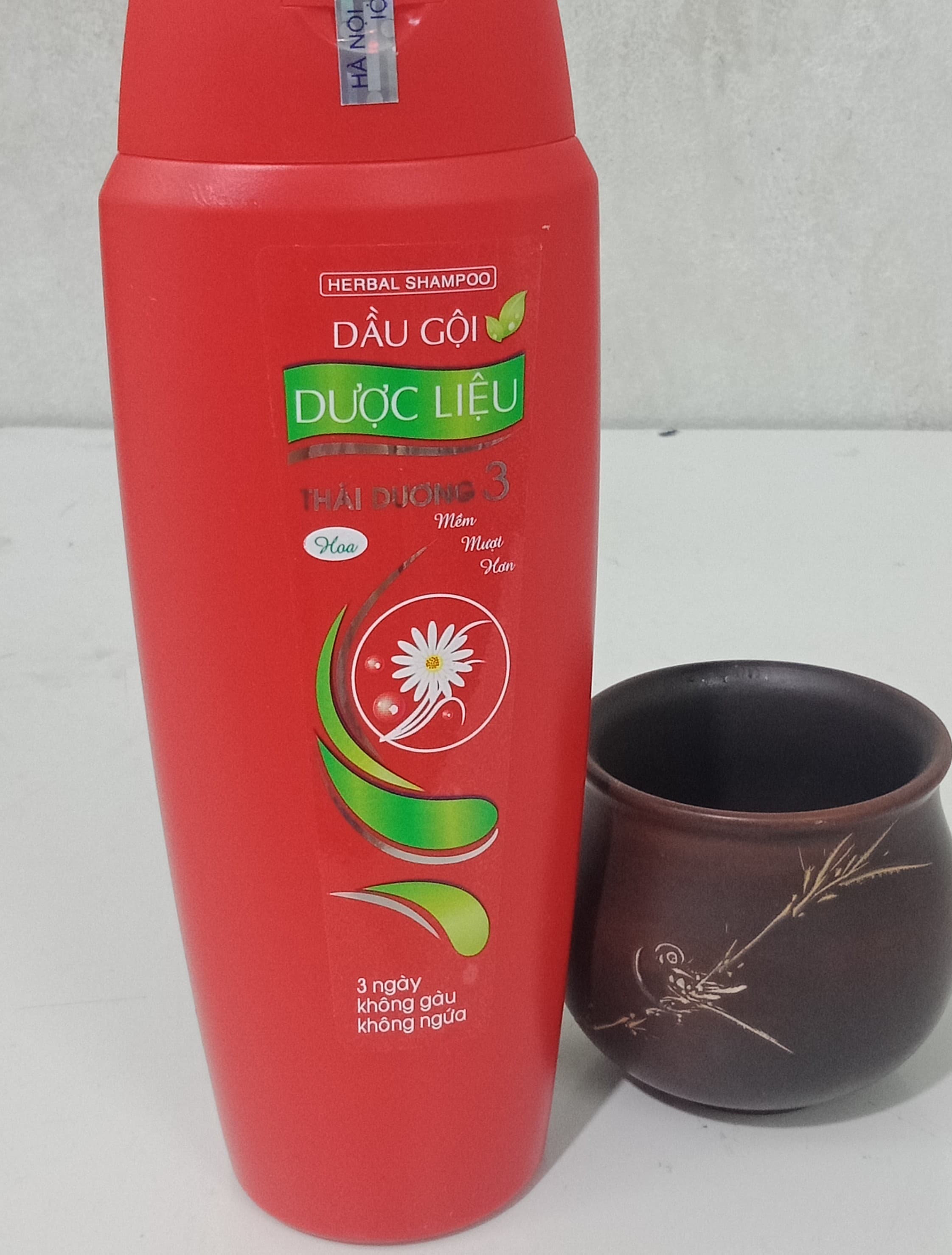 Dầu gội mọc tóc/ dầu gội Thái Dương 3  ( lọ 200ml hương hoa) tặng kèm bọt biển rửa mặt
